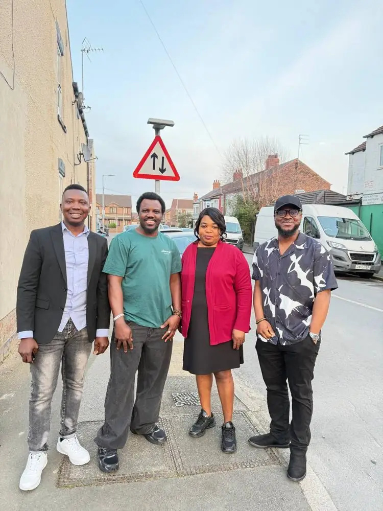 Ebenezer with three friends on a Hull street